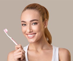 Woman holding a toothbrush 