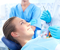 Woman in dental chair smiling