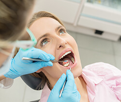 Woman receiving dental exam