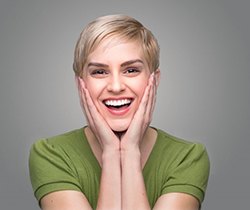 Smiling woman enjoying her new dental crown in Coppell 