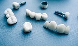 Different types of dental implants in Coppell on blue background