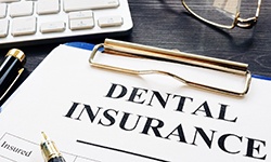 dental insurance paperwork for the cost of dental implants in Coppell