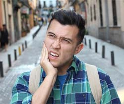 Pained man with questions for his Coppell emergency dentist