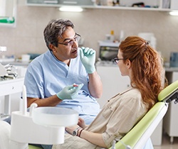 Implant dentist explaining procedure to patient