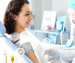 Young woman smiling in dental chair