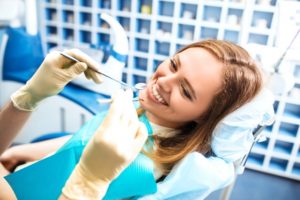 person smiling at their dentist