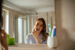 person brushing their teeth