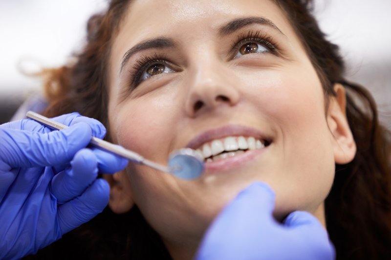 closeup of young woman in dental chair