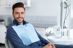 Man smiling while at the dentist
